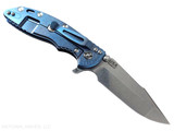 Rick Hinderer Knives XM-18 3.5" Harpoon Spanto folding knife with thumb stud and flipper tab - shown open lock side.  Stonewashed MagnaCut stainless steel plain edge blade.  Black G-10 handle with stonewash blue lock side.  Model KXM35HS.