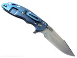 Rick Hinderer Knives XM-18 3.5" Harpoon Spanto folding knife with thumb stud and flipper tab - shown open lock side.  Stonewashed MagnaCut stainless steel plain edge blade.  Translucent Green G-10 handle with stonewash blue lock side.  Model KXM35HS.