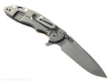 Rick Hinderer Knives XM-18 3.5" Spanto folding knife with thumb stud and flipper tab - shown open lock side.  Working Finish 20CV stainless steel plain edge blade.  Coyote G-10 handle with Working Finish lock side.  Model KXM35SPA.