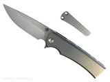 Chaves Knives Liberation Street Integral folding knife featuring a flipper tab - shown open presentation side. Belt satin M390 stainless steel drop point style plain edge blade. Stonewash titanium handle. Model CK-2B1-1A1A-1A0! Chaves Knives Liberation Street Integral folding knife featuring a flipper tab - shown open presentation side. Belt satin M390 stainless steel drop point style plain edge blade. Stonewash titanium handle. Model CK-2B1-1A1A-1A0!