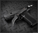 RMJ Tactical Gym Rat fixed blade knife - shown out of sheath obverse.  Graphite Black Cerakote Nitro-V stainless steel plain edge blade.  Black G- 10 handle.  Model K-GR-GB-BK.