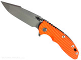 Rick Hinderer Knives XM-18 Skinny Harpoon Spanto with thumb stud and flipper tab - shown open presentation side.  Working Finish MagnaCut stainless steel plain edge blade.  Orange G-10 handle with Battle Bronze lock side.  Model KXM35SKHS.