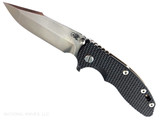 Rick Hinderer Knives XM-18 Skinny Harpoon Spanto with thumb stud and flipper tab - shown open presentation side.  Stonewash MagnaCut stainless steel plain edge blade.  Black G-10 handle with stonewash bronze lock side.  Model KXM35SKHS.