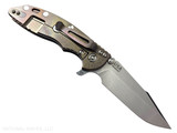 Rick Hinderer Knives XM-18 Skinny Harpoon Spanto with thumb stud and flipper tab - shown open lock side.  Stonewash MagnaCut stainless steel plain edge blade.  Black G-10 handle with stonewash bronze lock side.  Model KXM35SKHS.