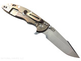 Rick Hinderer Knives XM-18 Skinny Harpoon Spanto with thumb stud and flipper tab - shown open lock side.  Stonewash MagnaCut stainless steel plain edge blade.  Translucent Green G-10 handle with stonewash bronze lock side.  Model KXM35SKHS. Rick Hinderer Knives XM-18 Skinny Harpoon Spanto with thumb stud and flipper tab - shown open lock side.  Stonewash MagnaCut stainless steel plain edge blade.  Translucent Green G-10 handle with stonewash bronze lock side.  Model KXM35SKHS.