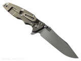 Rick Hinderer Knives Skinny Eklipse Slicer folding knife with flipper tab - shown open - lock side.  Working Finish 3.5" hollow grind MagnaCut stainless steel plain edge blade.  Coyote G-10 handle scale with Battle Bronze lock side.  Model KEK35SKSLHO Rick Hinderer Knives Skinny Eklipse Slicer folding knife with flipper tab - shown open - lock side.  Working Finish 3.5" hollow grind MagnaCut stainless steel plain edge blade.  Coyote G-10 handle scale with Battle Bronze lock side.  Model KEK35SKSLHO
