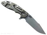 Rick Hinderer Knives XM-18 Skinny Harpoon Spanto with thumb stud and flipper tab - shown open lock side.  Working Finish MagnaCut stainless steel plain edge blade.  Coyote G-10 handle with Battle Bronze lock side.  Model KXM35SKHS. Rick Hinderer Knives XM-18 Skinny Harpoon Spanto with thumb stud and flipper tab - shown open lock side.  Working Finish MagnaCut stainless steel plain edge blade.  Coyote G-10 handle with Battle Bronze lock side.  Model KXM35SKHS.