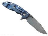 Rick Hinderer Knives XM-18 3.5" Harpoon Spanto folding knife with thumb stud and flipper tab - shown open lock side.  Working Finish MagnaCut stainless steel plain edge blade.  Blue - black G-10 handle with Battle Blue lock side.  Model KXM35HS.