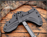 RMJ Tactical Kestrel tomahawk - close up of head in sheath obverse.  Tungsten Cerakote S7 steel plain edge head.  Black G-10 handle.  Model T-KE-S7-TU-BL.