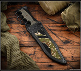 RMJ Tactical Marauder - shown in sheath obverse. Graphite Black Cerakote 3V steel plain edge blade.  Dirty Olive G-10 handle scales.  Model K-MD-3V-GB-DO-BLK/VT.