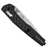 Zero Tolerance 0117 folding knife with thumb studs - shown closed pocket clip side.  2-Tone MagnaCut stainless steel plain edge blade.  Carbon Fiber handle with button lock.  Model 0117.