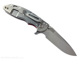 Rick Hinderer Knives XM-18 3.25" Spear Point folding knife with thumb stud and flipper tab - shown open lock side.  Stonewash S45VN stainless steel plain edge blade.  Red G-10 handle with stonewash lock side.  Model KXM325SPE.