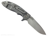Rick Hinderer Knives XM-18 3.25" Spear Point folding knife with thumb stud and flipper tab - shown open lock side.  Stonewash S45VN stainless steel plain edge blade.  Black G-10 handle with Working Finish lock side.  Model KXM325SPE.