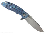 Rick Hinderer Knives XM-18 3.25" Spear Point folding knife with thumb stud and flipper tab - shown open lock side.  Stonewash S45VN stainless steel plain edge blade.  Blue G-10 handle with stonewash blue lock side.  Model KXM325SPE.