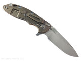 Rick Hinderer Knives XM-18 3.25" Spear Point folding knife with thumb stud and flipper tab - shown open lock side.  Stonewash S45VN stainless steel plain edge blade.  Coyote G-10 handle with stonewash bronze lock side.  Model KXM325SPE.