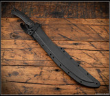 RMJ Tactical Wyvern short sword - shown in sheath.  Acid Etched 3V steel plain edge blade.  Black G-10 handle scales.  Model 3V-WY-AE-BK.
