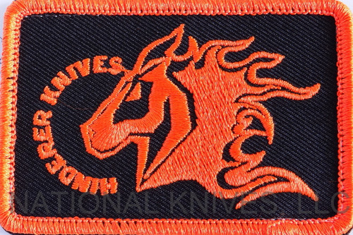 Rick Hinderer Knives Horse Head Logo Morale Patch - obverse.  Orange and black with hook and loop backing.  Model A001000000-ORBK.
For reference only.