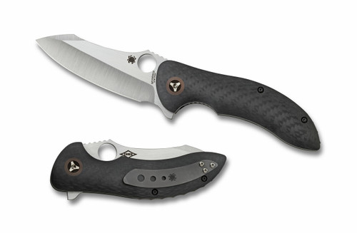 Spyderco Magnitude folding knife with thumb hole and flipper tab - shown open presentation side and closed lock side.  Satin S30V stainless steel plain edge blade.  Black carbon fiber handle.  Model C212CFP.