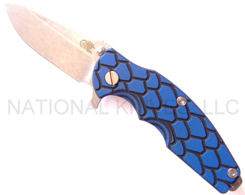Rick Hinderer Knives Jurassic Spear Point folding knife with thumb stud and flipper tab - shown open presentation side.  Stonewash S35VN stainless steel plain edge blade.  Blue - black G-10 handle with stonewash lock side.  Model K208J0SP00.
For reference only.