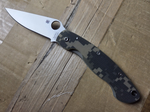 Used Spyderco Military folding knife with thumb hole - shown open presentation side.  Satin S30V stainless steel plain edge blade.  Digi Camo G-10 handle.  Model C36GPCMO.