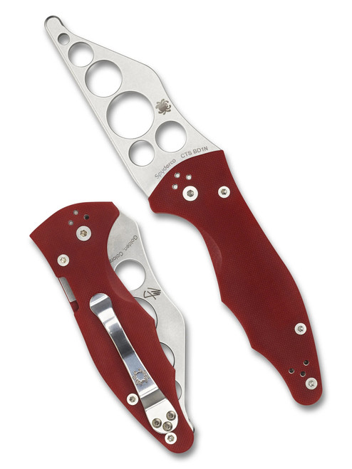 Spyderco Yojimbo 2 Trainer folding knife with thumb hole - shown open presentation side and closed pocket clip side.  CTS-BD1N stainless steel trainer blade.  Red G-10 handle. Model C85TR2.