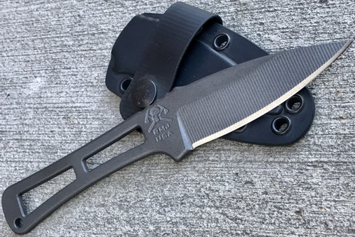 RMJ Tactical Utsidihi fixed blade knife - shown out of sheath obverse with sheath in background.  Tungsten Cerakote Nitro-V stainless steel plain edge blade.  
For reference only.