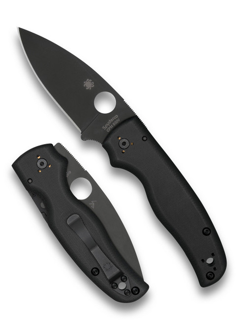 Spyderco Shaman folding knife with thumb hole - shown open presentation side and closed pocket clip side.  Black S30V stainless steel plain edge blade.  Black G-10 handle.  Model C229GPBK.