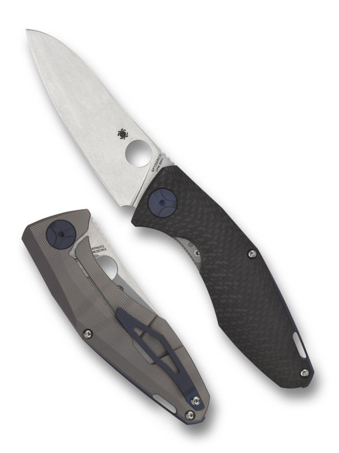 Spyderco Drunken folding knife with thumb hole - shown open presentation side and closed pocket clip side.  Satin S90V stainless steel plain edge blade.  Black carbon fiber handle with titanium lock side.  Model C235CFTIP.