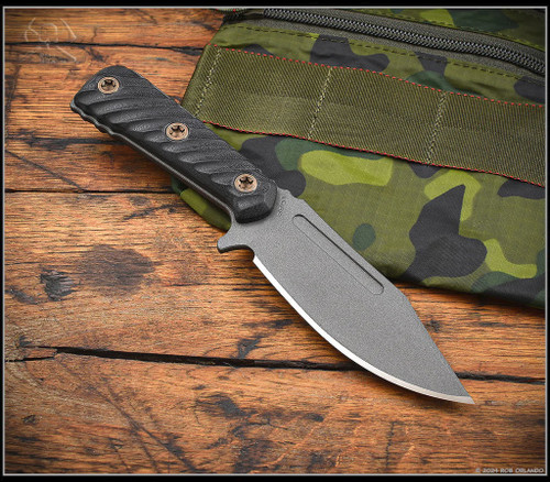 RMJ Tactical UCAP fixed blade knife - shown out of sheath obverse.  Tungsten Cerakote Nitro-V stainless steel plain edge blade.  Black G-10 handle.