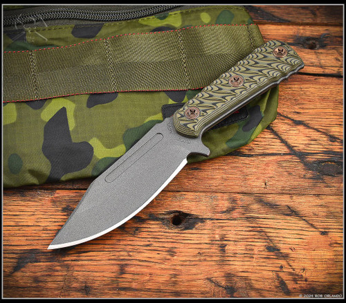 RMJ Tactical UCAP fixed blade knife - shown out of sheath reverse.  Tungsten Cerakote Nitro-V stainless steel plain edge blade.  Dirty Olive G-10 handle.