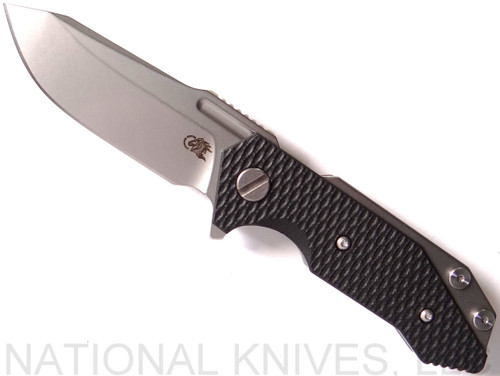 Rick Hinderer Knives Half Track Spear Point folding knife with flipper tab - shown open presentation side.  Stonewash 20CV stainless steel plain edge blade.  Black G-10 handle with stonewash titanium lock side.  Model K2009SGS00.
