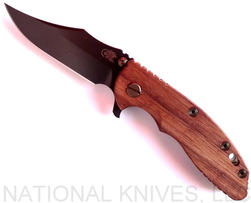 Rick Hinderer Knives Vintage Series XM-18 3.5" Bowie folding knife with thumb stud and flipper tab - shown open presentation side.  Black O-1 steel plain edge blade.  Smooth Walnut handle with Battle Green titanium lock side.  Model K2032S0VT.
For reference only.