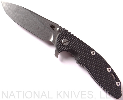 Rick Hinderer Knives XM-18 3.5" Slicer folding knife with thumb stud and flipper tab - shown open presentation side.  Stonewash 20CV stainless steel plain edge blade.  Black G-10 handle with stonewash titanium lock side.  Model K2012SGS00.