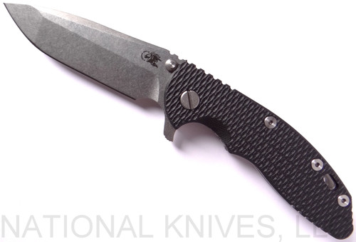 Rick Hinderer Knives XM-18 3.5" Spanto folding knife with thumb stud and flipper tab - shown open presentation side.  Stonewash 20CV stainless steel plain edge blade.  Black G-10 handle with stonewash lock side.  Model K2002SGS00.