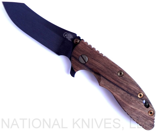 Rick Hinderer Knives Vintage Series XM-18 3.5" Skinner folding knife with thumb stud and flipper tab - shown open presentation side.  Black O-1 steel plain edge blade.  Smooth Walnut handle with Battle Green titanium lock side.  Model K2042S0VT00.
For reference only.