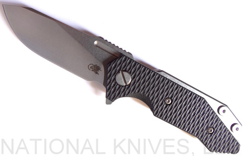 Rick Hinderer Knives Half Track Slicer folding knife with flipper tab - shown open presentation side.  Stonewash 20CV stainless steel plain edge blade.  Black G-10 handle with stonewash titanium lock side.  Model K2009SGS00.
