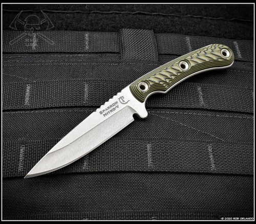 RMJ Tactical Sparrow fixed blade knife - shown out of sheath reverse.  Stonewash Nitro-V stainless steel plain edge blade.  Dirty Olive G-10 handle.
For reference only.