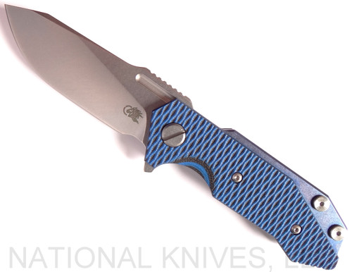 Rick Hinderer Knives Half Track folding knife with flipper tab - shown open presentation side.  Stonewash 20CV stainless steel plain edge blade.  Blue - black G-10 handle with stonewash blue titanium lock side.  Model K2009SGS00.

