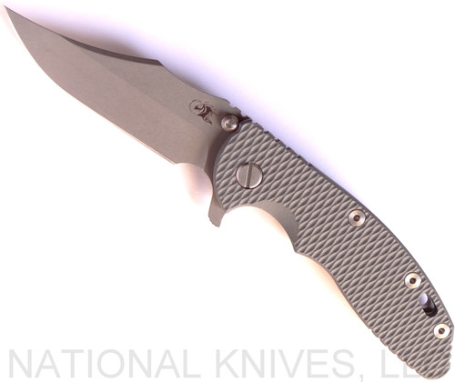 Rick Hinderer Knives XM-18 3.5" Bowie folding knife with thumb stud and flipper tab - shown open presentation side.  Working Finish 20CV stainless steel plain edge blade.  Grey G-10 handle with Working Finish titanium lock side.  Model K2032SGW00.