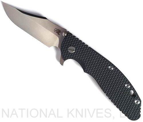 Rick Hinderer Knives XM-24 Bowie folding knife with thumb stud and flipper tab - shown open presentation side.  Stonewash 20CV stainless steel plain edge blade.  Black G-10 handle with stonewash bronze lock side.  Model KXM40BO.