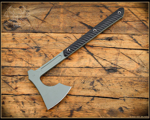 RMJ Tactical 3V Syndicate Raven tomahawk - shown out of sheath reverse.  Jungle Green Cerakote CPM-3V steel plain edge head.  Black G-10 handle.
For reference only.