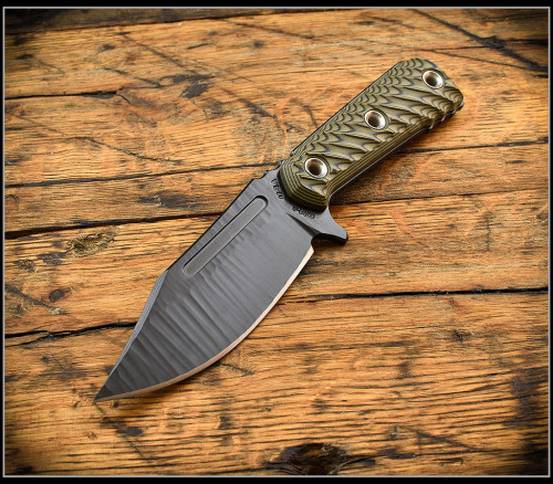 RMJ Tactical UCAP fixed blade knife - shown out of sheath reverse.  Textured black Cerakote Nitro-V stainless steel plain edge blade.  Dirty Olive G-10 handle.