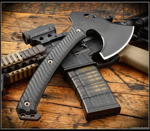 RMJ Tactical Weeserker Camp Axe - shown out of sheath obverse.  Black 80CRV2 steel plain edge head.  Black G-10 handle.