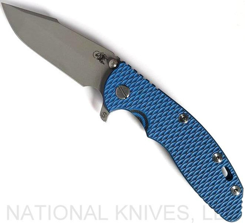 Rick Hinderer Knives Skinny XM-18 3.5" Harpoon Spanto folding knife with thumb stud and flipper tab - shown open presentation side.  Working Finish 20CV stainless steel plain edge blade.  Blue - black G-10 handle with Battle Blue lock side.  Model K2555SGW00.
