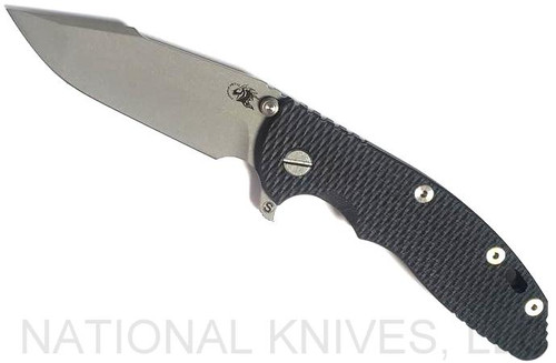 Rick Hinderer Knives Skinny XM-18 3.5" Harpoon Spanto folding knife with thumb stud and flipper tab - shown open presentation side.  Working Finish 20CV stainless steel plain edge blade.  Black G-10 handle with Battle Bronze lock side.  Model K2555SGW00.