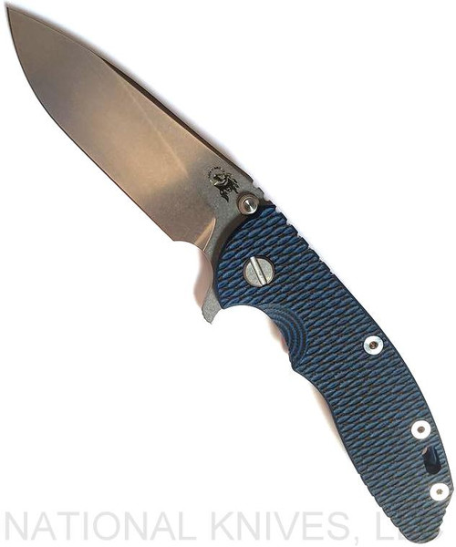 Rick Hinderer Knives XM-18 3.5" Slicer folding knife with thumb stud and flipper tab - shown open presentation side.  Stonewash 20CV stainless steel plain edge blade.  Blue - black G-10 handle with stonewash blue lock side.  Model K310102S000.
