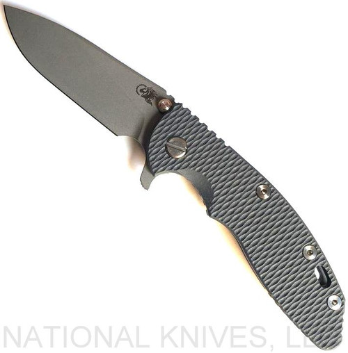 Rick Hinderer Knives XM-18 3.5" Slicer folding knife with thumb stud and flipper tab - shown open presentation side.  Working Finish 20CV stainless steel plain edge blade.  Grey G-10 handle with Working Finish lock side.  Model K310102001.