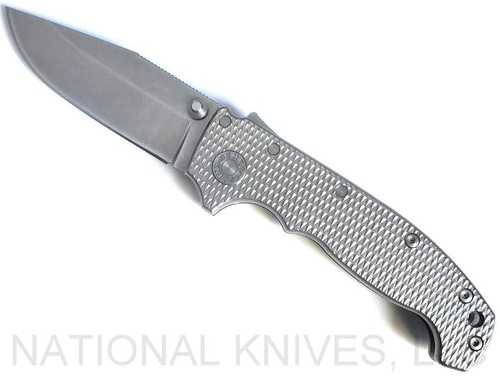 Demko Knives MG AD-20 clip point folding knife with thumb stud - shown open presentation side.  Stonewash 20CV stainless steel plain edge blade.  Textured titanium handle.