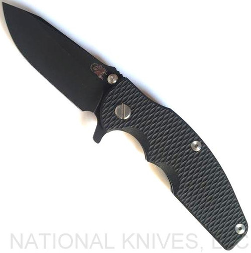 Rick Hinderer Knives Jurassic Spear Point folding knife with thumb stud and flipper tab - shown open presentation side.  Battle Black 20CV stainless steel plain edge blade.  Black G-10 handle with Battle Black lock side.  Model K208JSGDBK.

