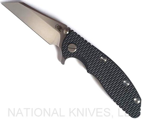 Rick Hinderer Knives XM-18 3.0" Wharncliffe folding knife with thumb stud and flipper tab - shown open presentation side.  Stonewash 20CV stainless steel plain edge blade.  Black G-10 handle with stonewash lock side.  Model KXM3000WC.